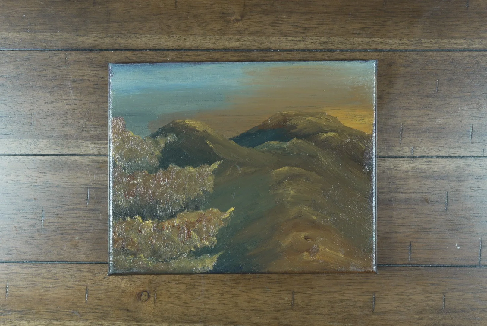 Unframed 10x8 canvas of the Presidential Range at sundown, shown on a wood floor