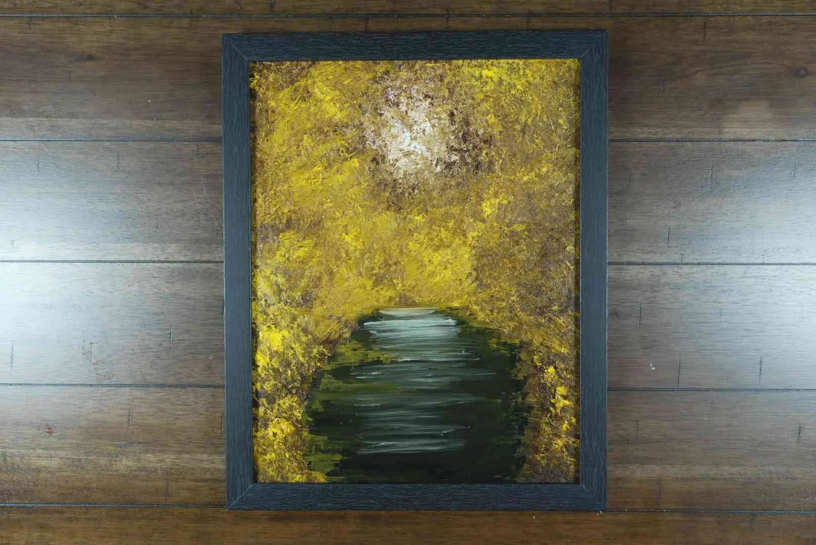 Under the Gilded Canopy in a black wood frame