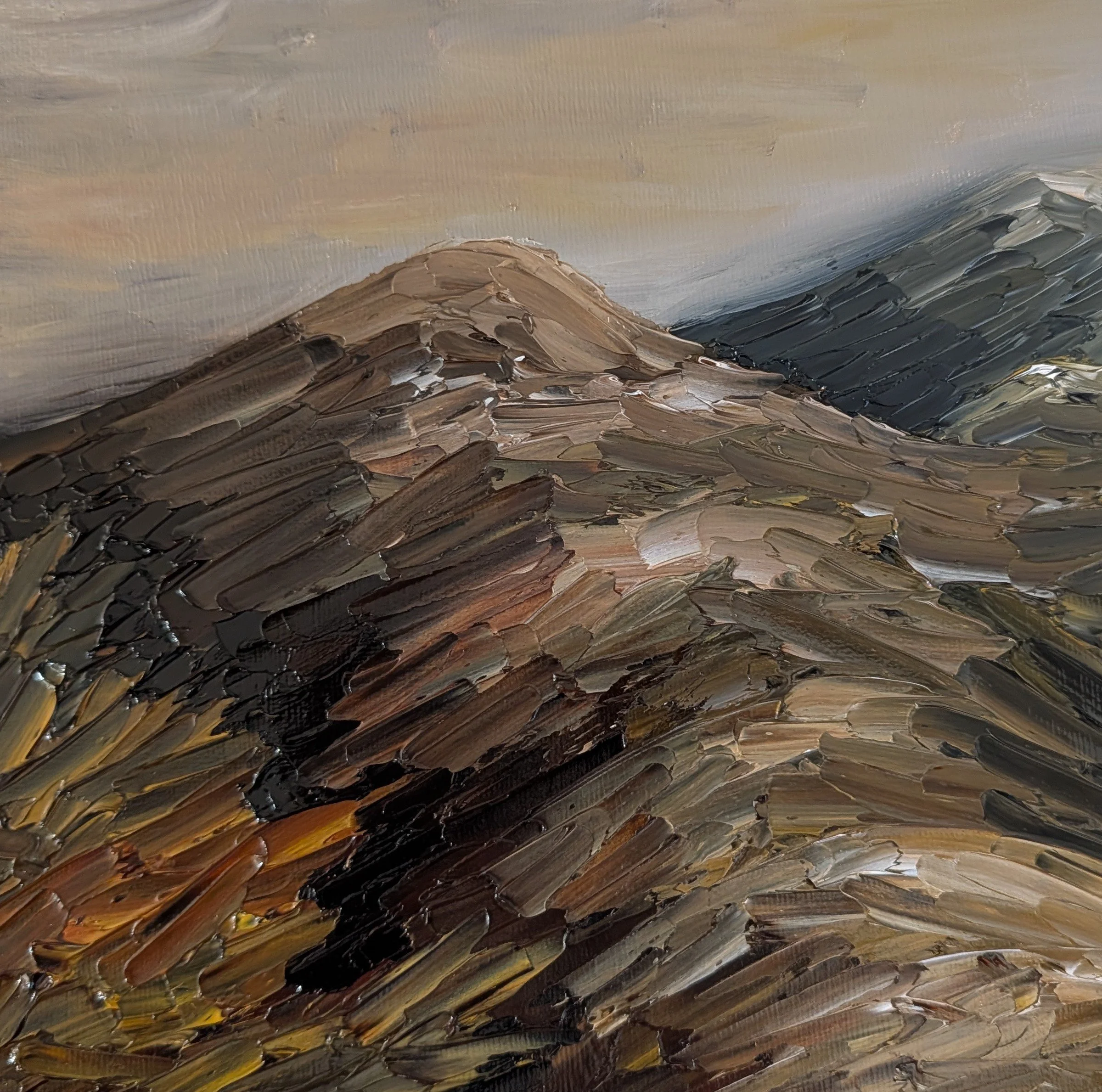A close-up of an impressionist painting of mountains with thick, textured brushstrokes in brown, black, gray, and hints of yellow.