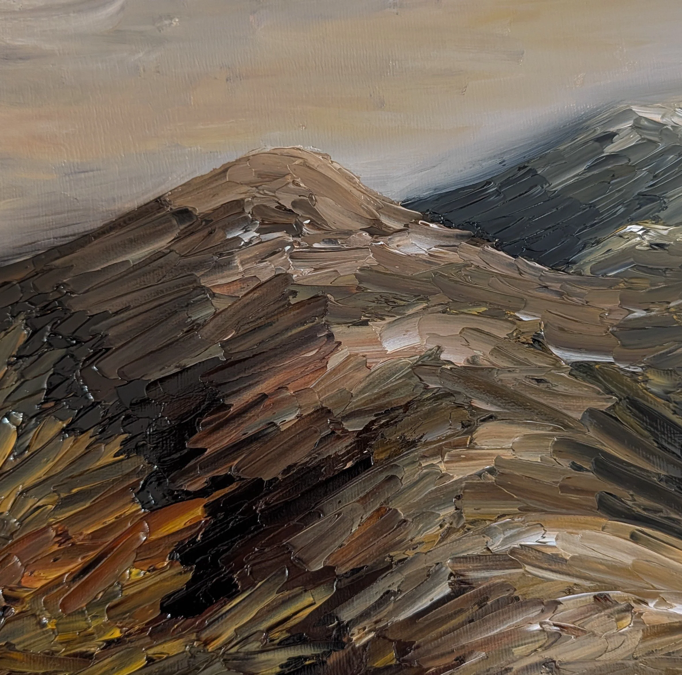 Close-up of a landscape painting depicting mountain peaks with thick, textured brushstrokes in earth tones, with a sky in muted colors in the background.