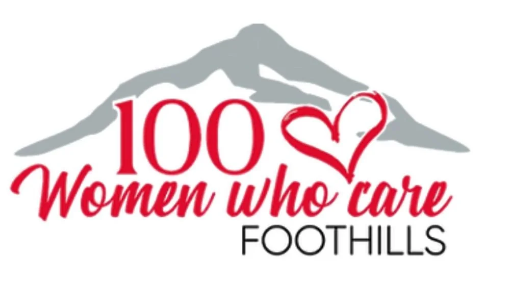 Logo with mountain outline, red text reading '100 Women who care' with a red heart, and black text saying 'FOOTHILLS'.