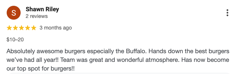 Screenshot of a Google review for a burger restaurant, five-star rating by Shawn Riley, praising the Buffalo burgers and atmosphere.