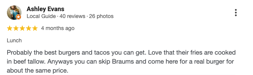 Review summary by Ashley Evans praising a burger and taco restaurant with cooked beef tallow fries and a good value for a burger.