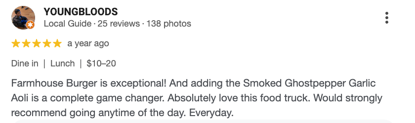 Screenshot of a Yelp review for Young Bloods, a food truck, praising their farmhouse burger with smoked ghost pepper garlic aoli.