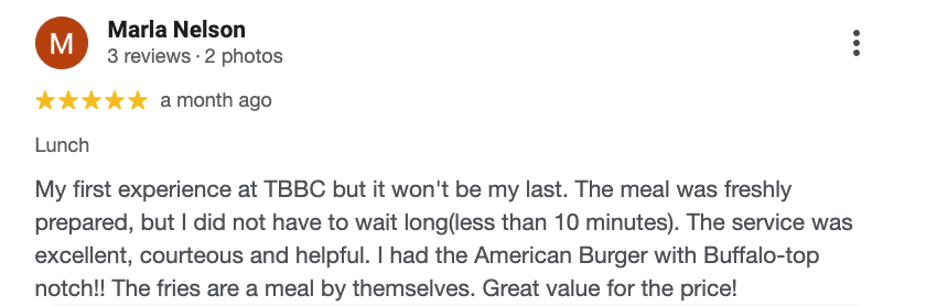 Screenshot of a Google review by Marla Nelson praising a restaurant for lunch, mentioning the American Burger with Buffalo-top notch and that the fries are self-served.