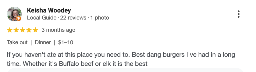 Screenshot of a Google review by Keisha Woodey praising a restaurant for its burgers, mentioning takeout, dinner prices, and recommending it for both buffalo beef and elk burgers.