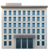 A multi-story modern office building with many windows and a central entrance