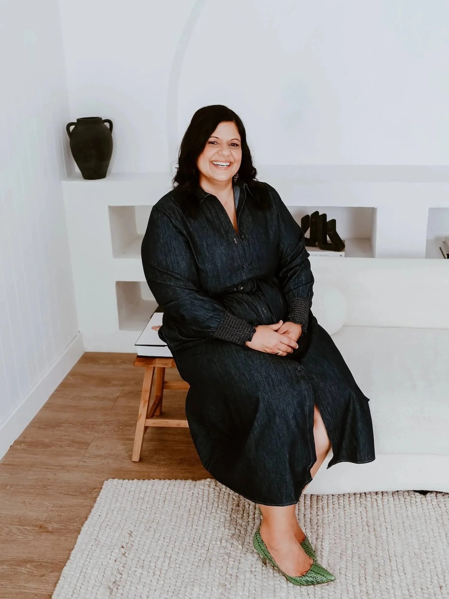 Alfina Lofaro, relationship educator and kinesiologist, seated in a calm professional setting