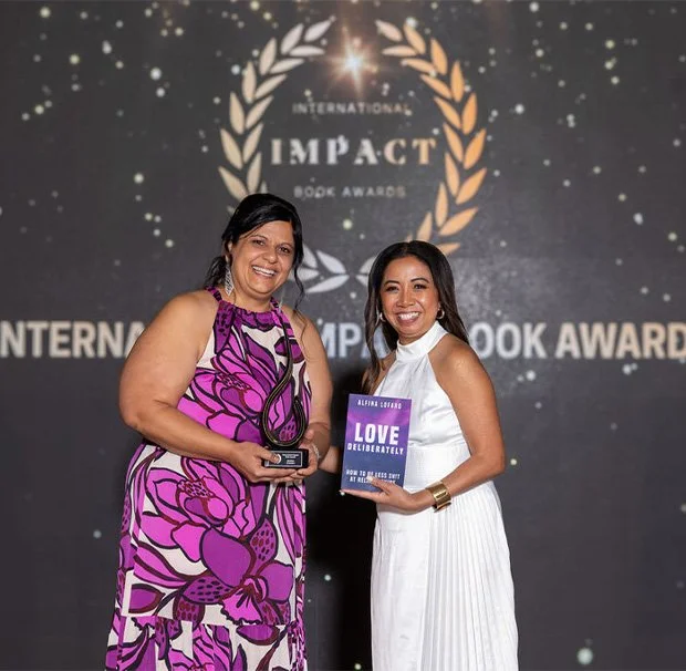 Alfina Lofaro accepting the International Impact Book Award for Love Deliberately