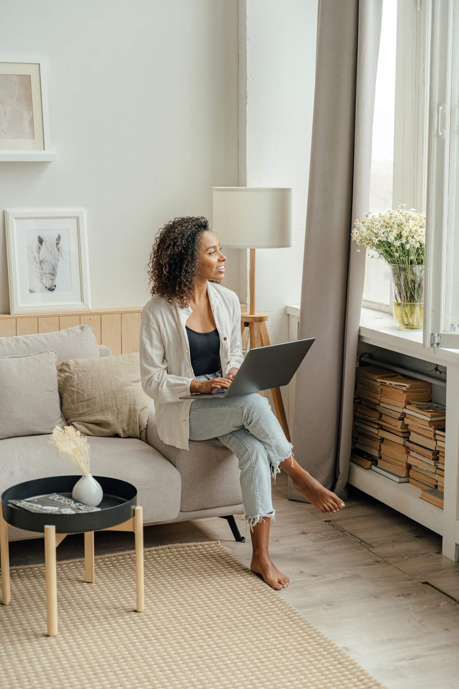 Woman engaged in focused learning on a laptop, representing intentional self-development through online relationship courses