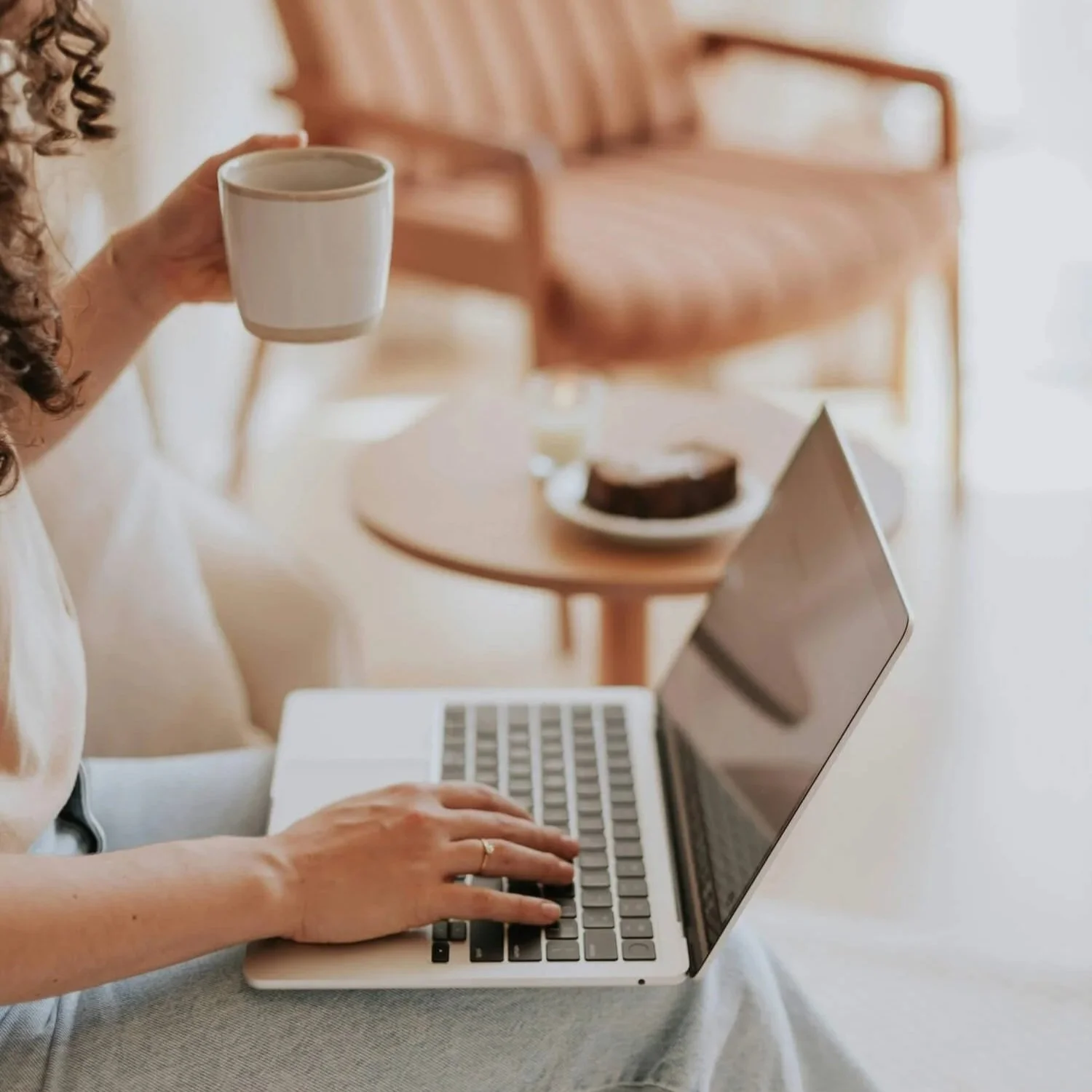 Woman engaging with online relationship course content on a laptop
