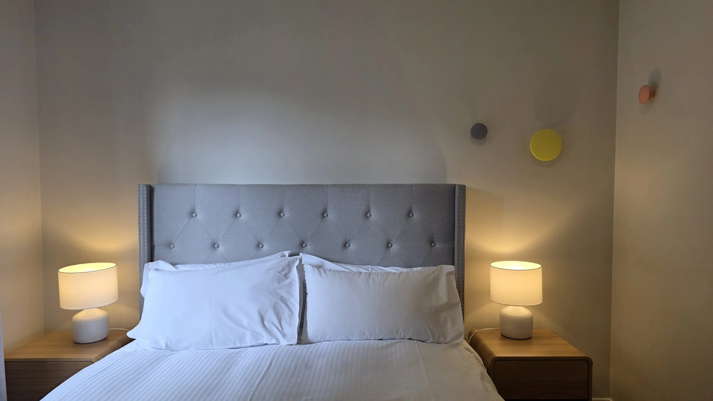Master bedroom - with queen bed, clothes rack, and ensuite