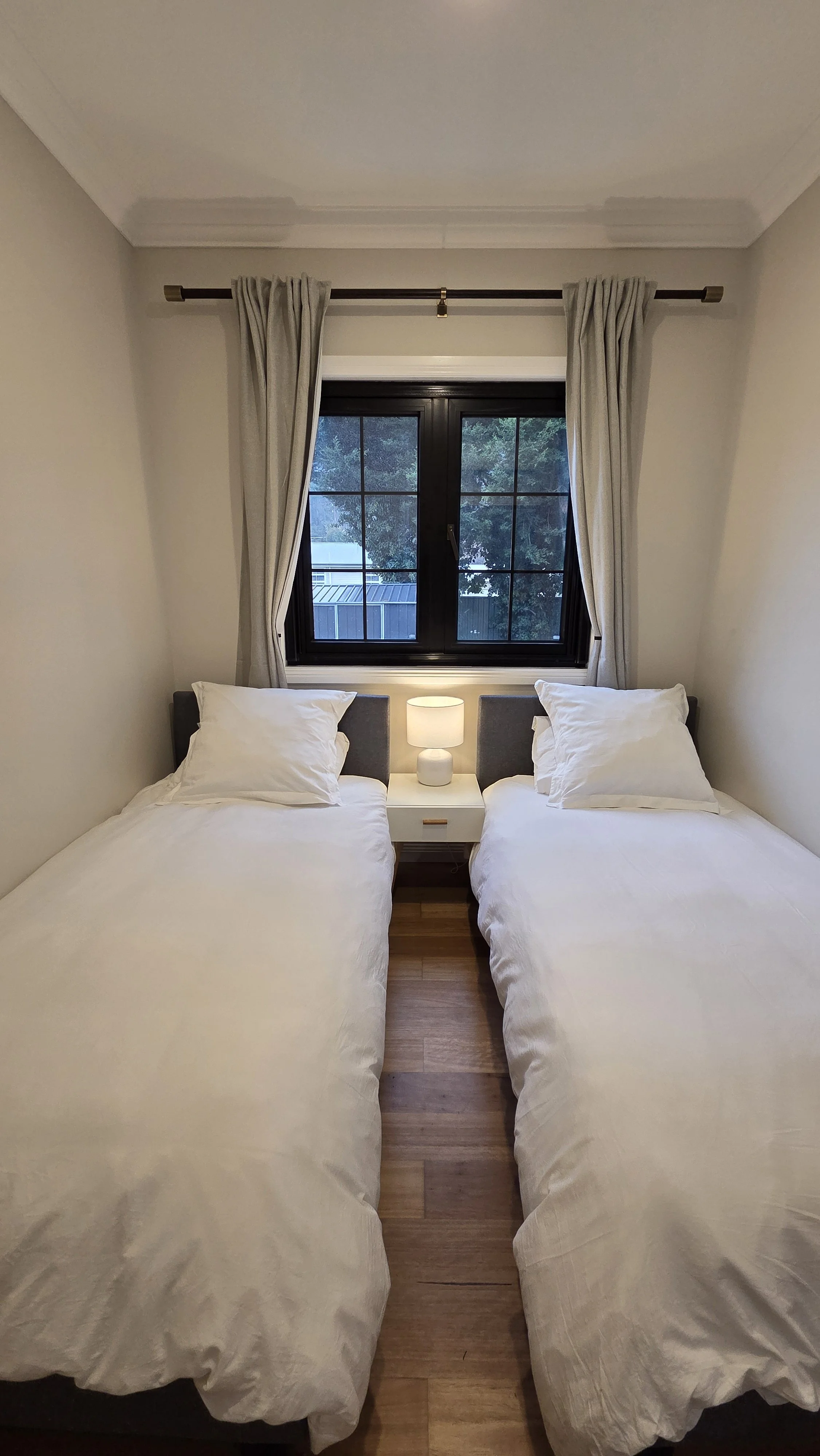 This bedroom is perfect for children or single guests who prefer to have their own bed. It also includes a clothing rack suitable for two people.