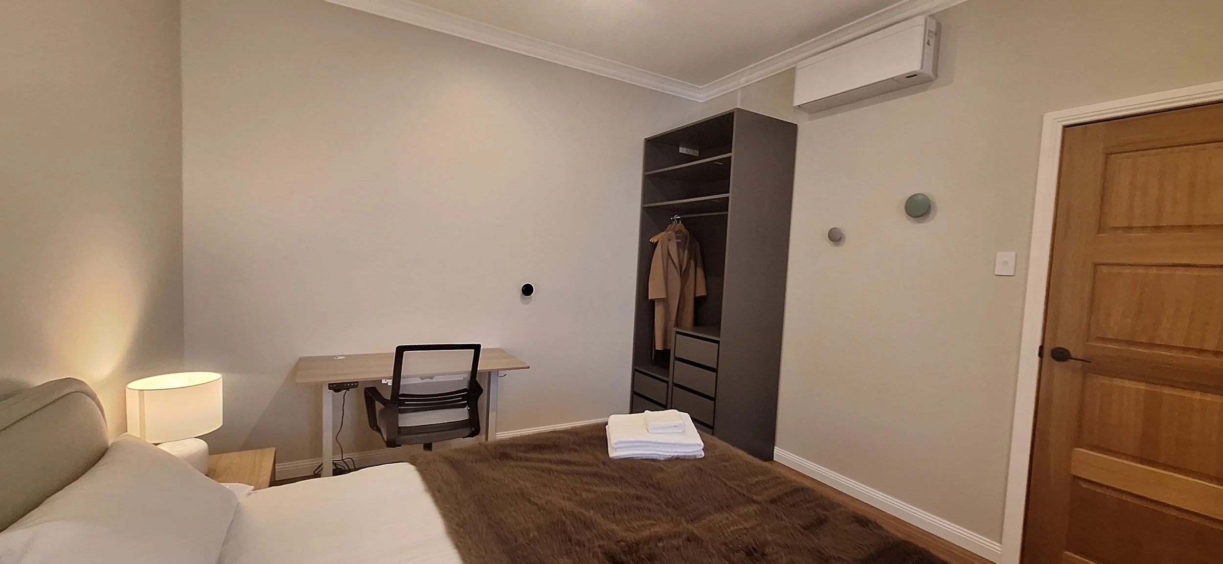 Bedroom 2 - Height adjustable table, chair, and wardrobe
