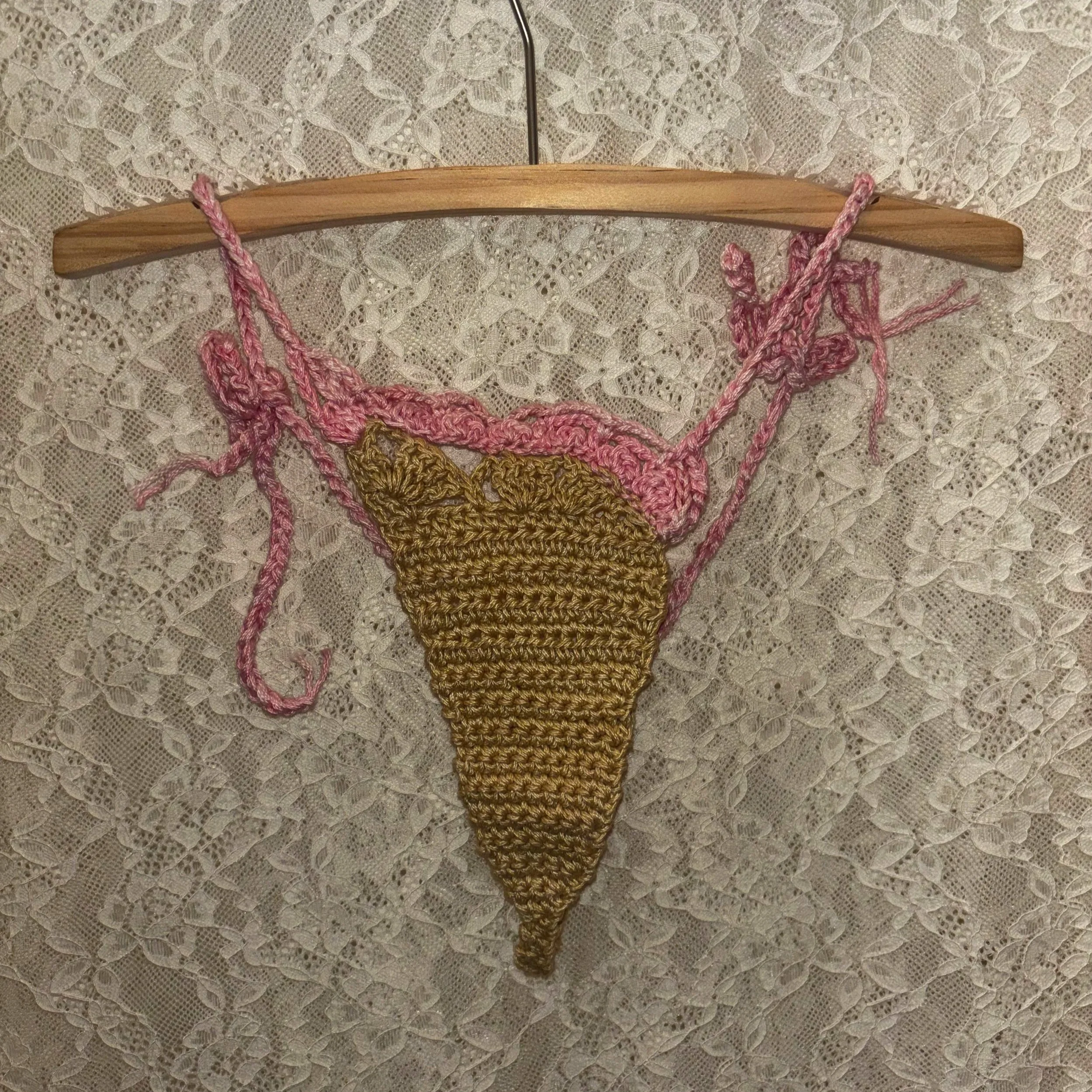 Cotton crochet bikini bottom. Featuring light green and pink.