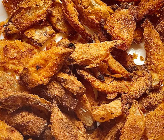 Close-up of fried chicken wings on a plate.