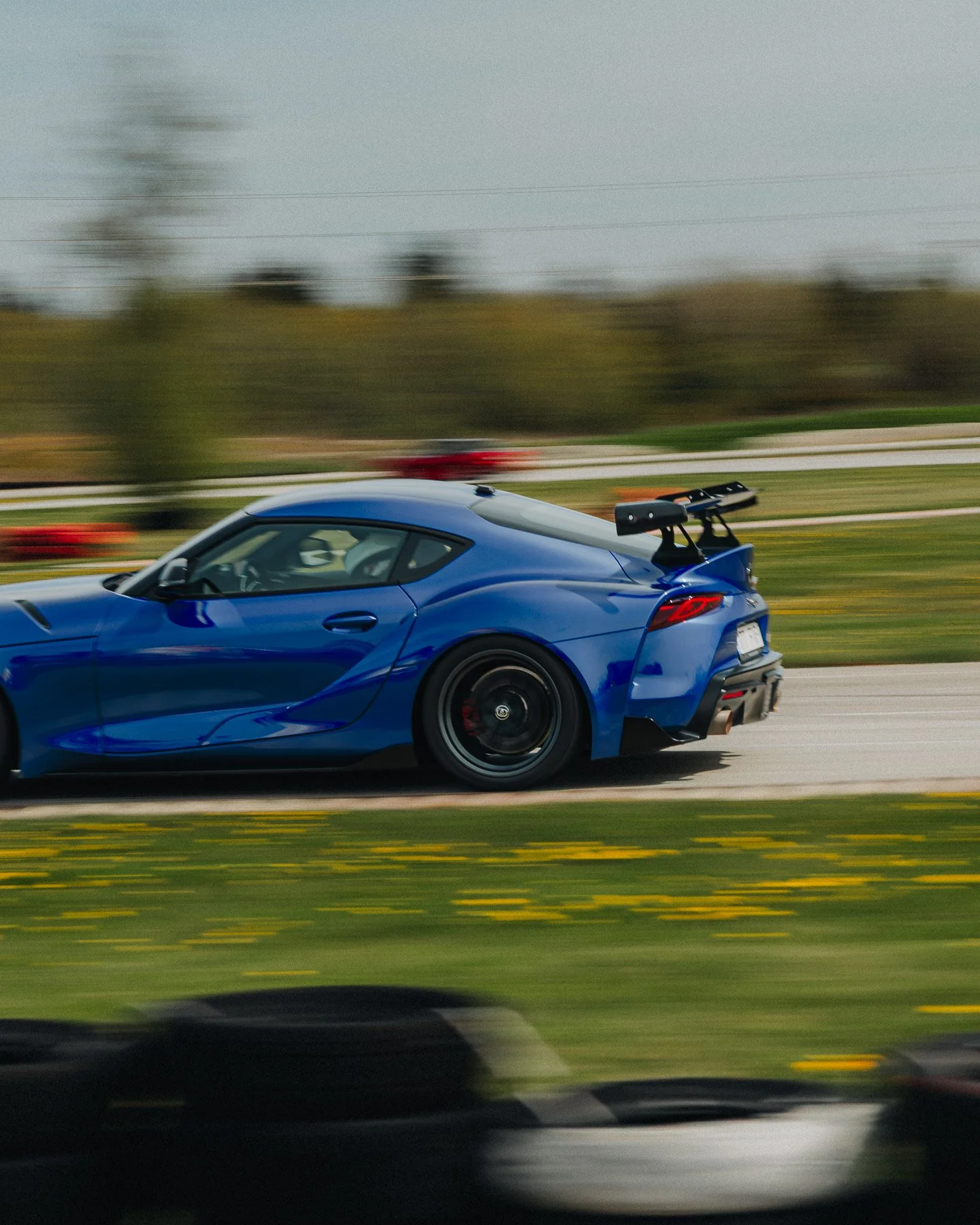 blue-toyota-supra-racing-track-action-shot-automotive-photography.jpg
