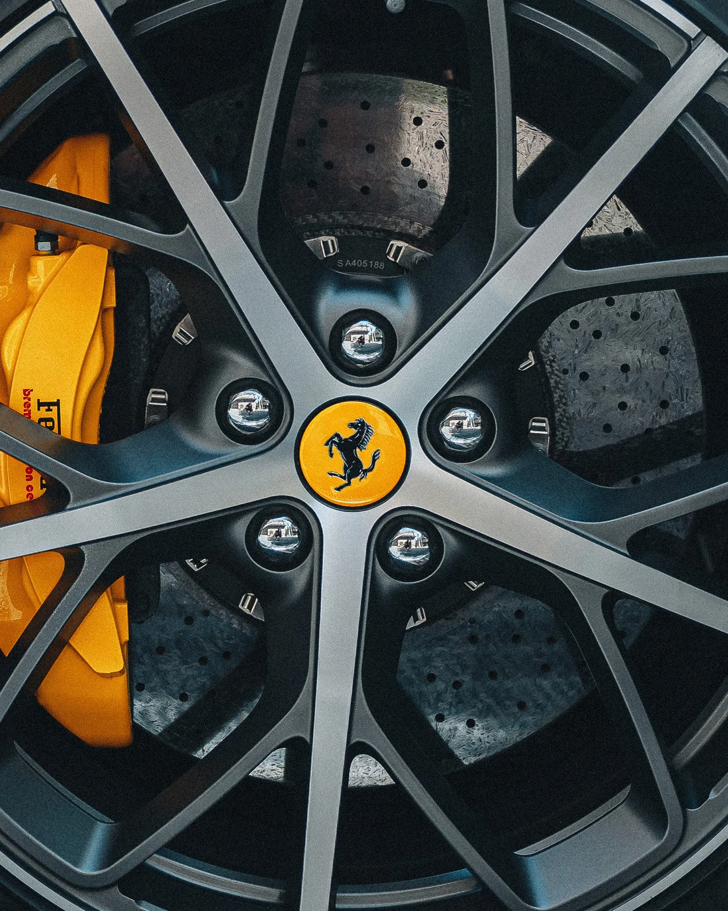 ferrari-yellow-brake-caliper-closeup-alloy-wheel-performance-supercar-reiko.jpg