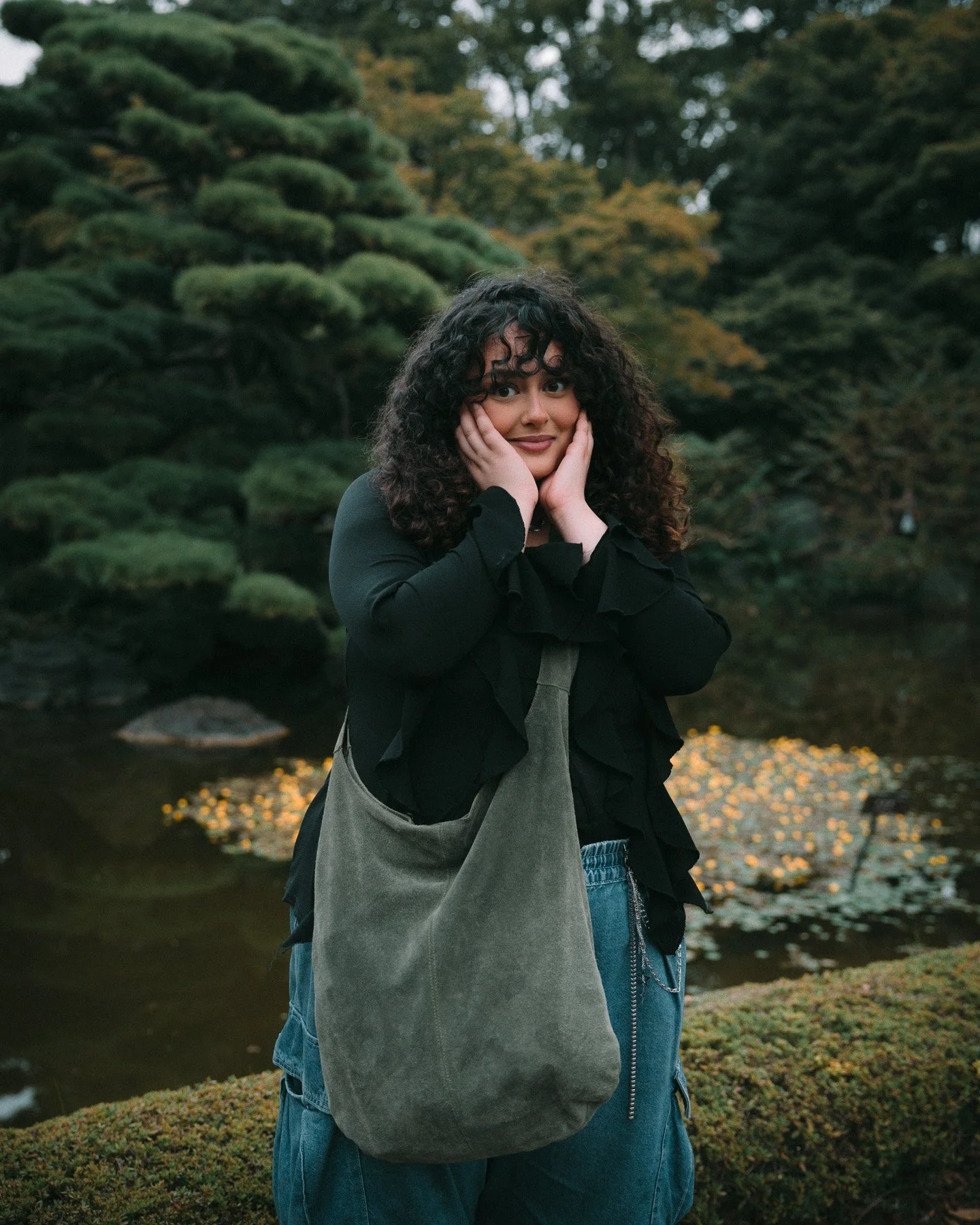 moody-portrait-curly-haired-woman-japanese-garden.jpg