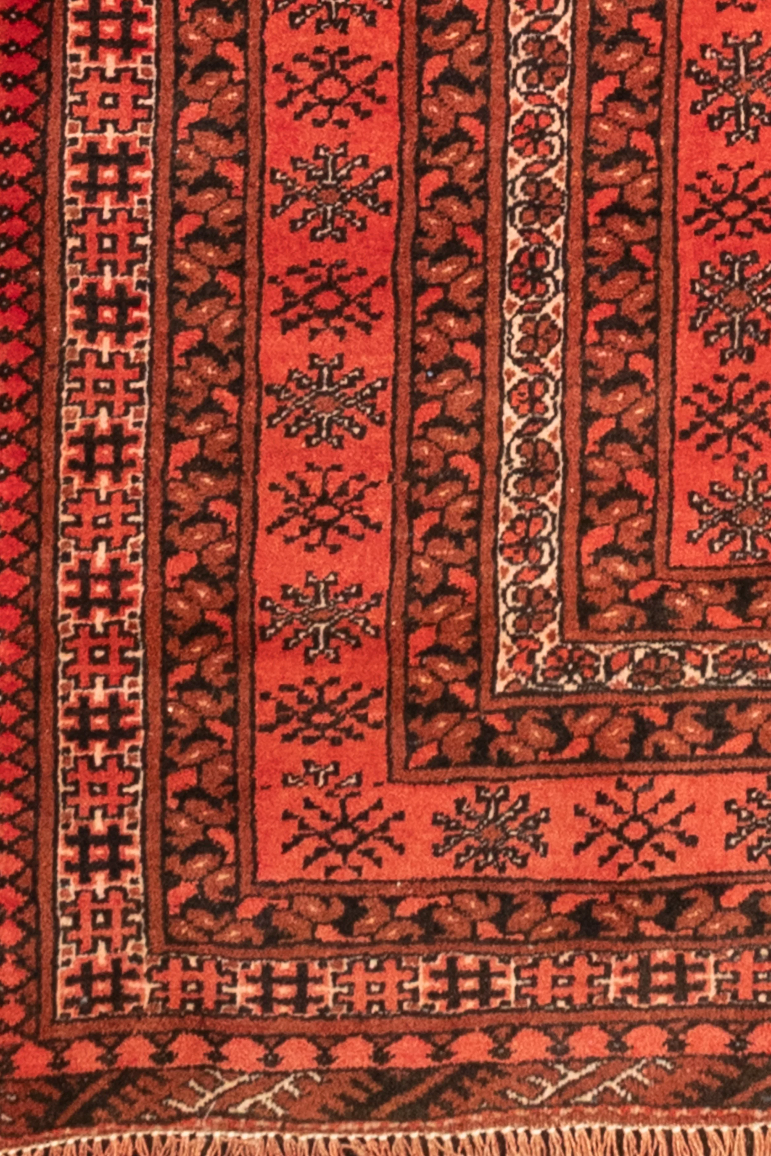 Vintage Persian Turkoman wool rug in red and black, handwoven in Iran, 280 × 200 cm