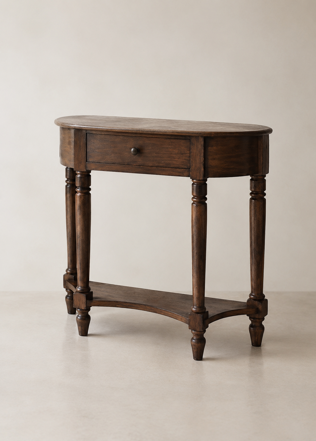 Wooden side table with a drawer and a lower shelf against a plain background.