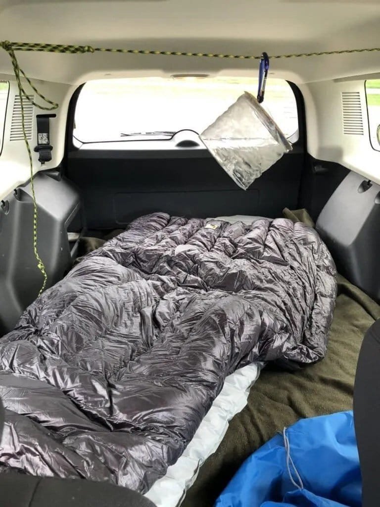 My makeshift camper setup in the back of my Jeep Patriot.
