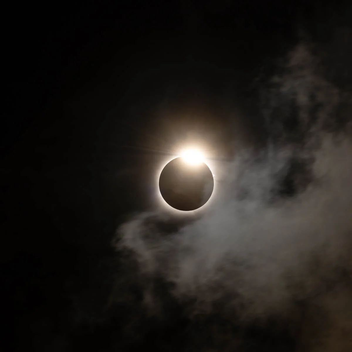 The sun starting to re-emerge from behind the moon during the 2024 total solar eclipse.