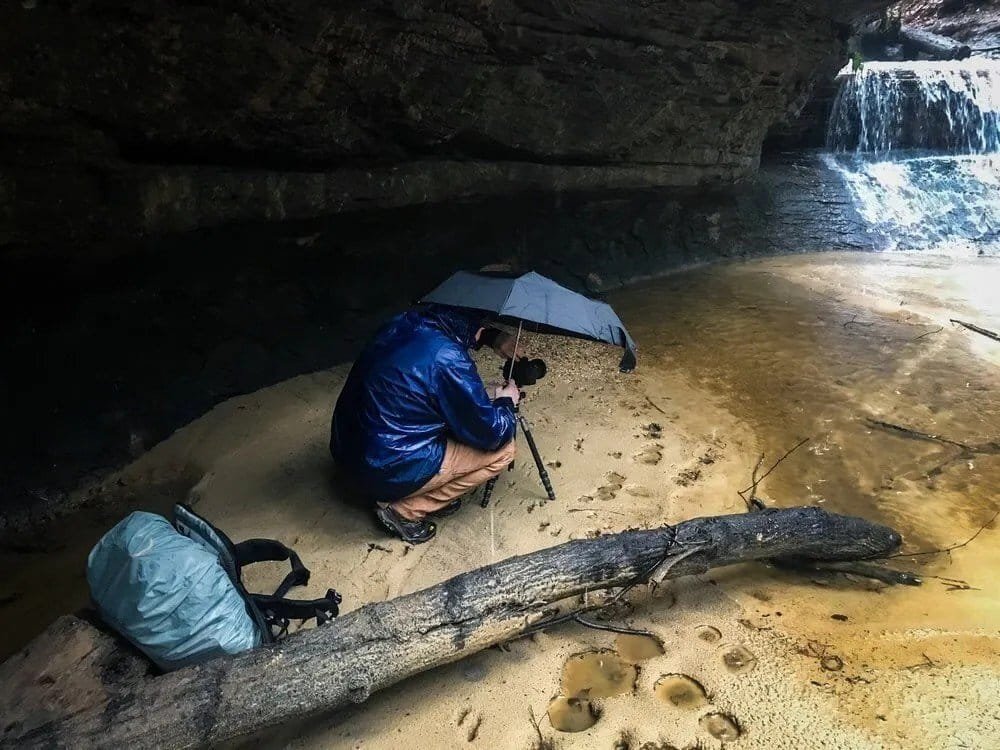 Adam Thompson shooting Princess Falls in the rain.