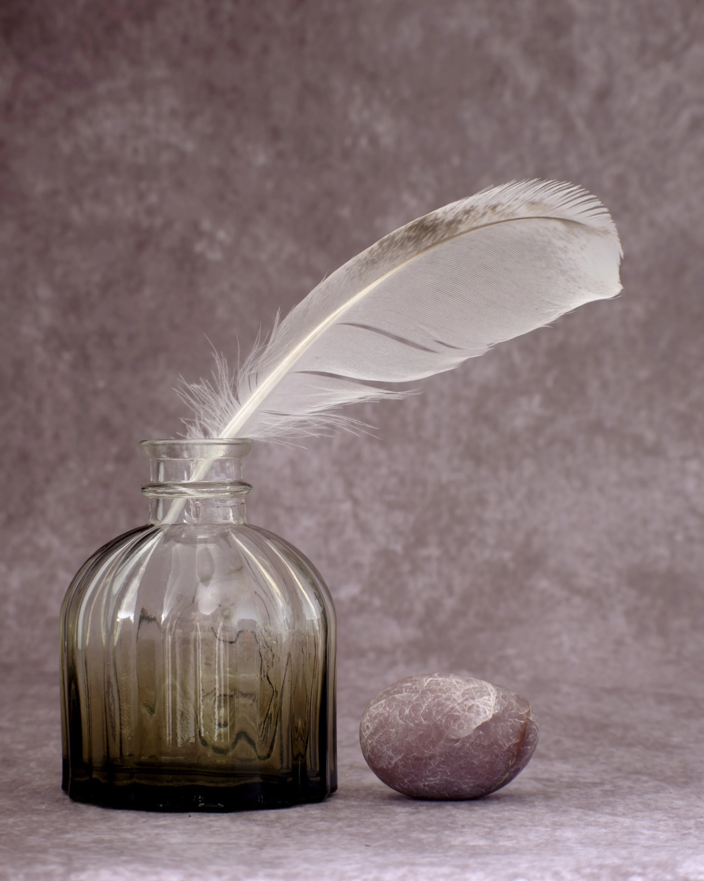 Feather, Bottle and Stone