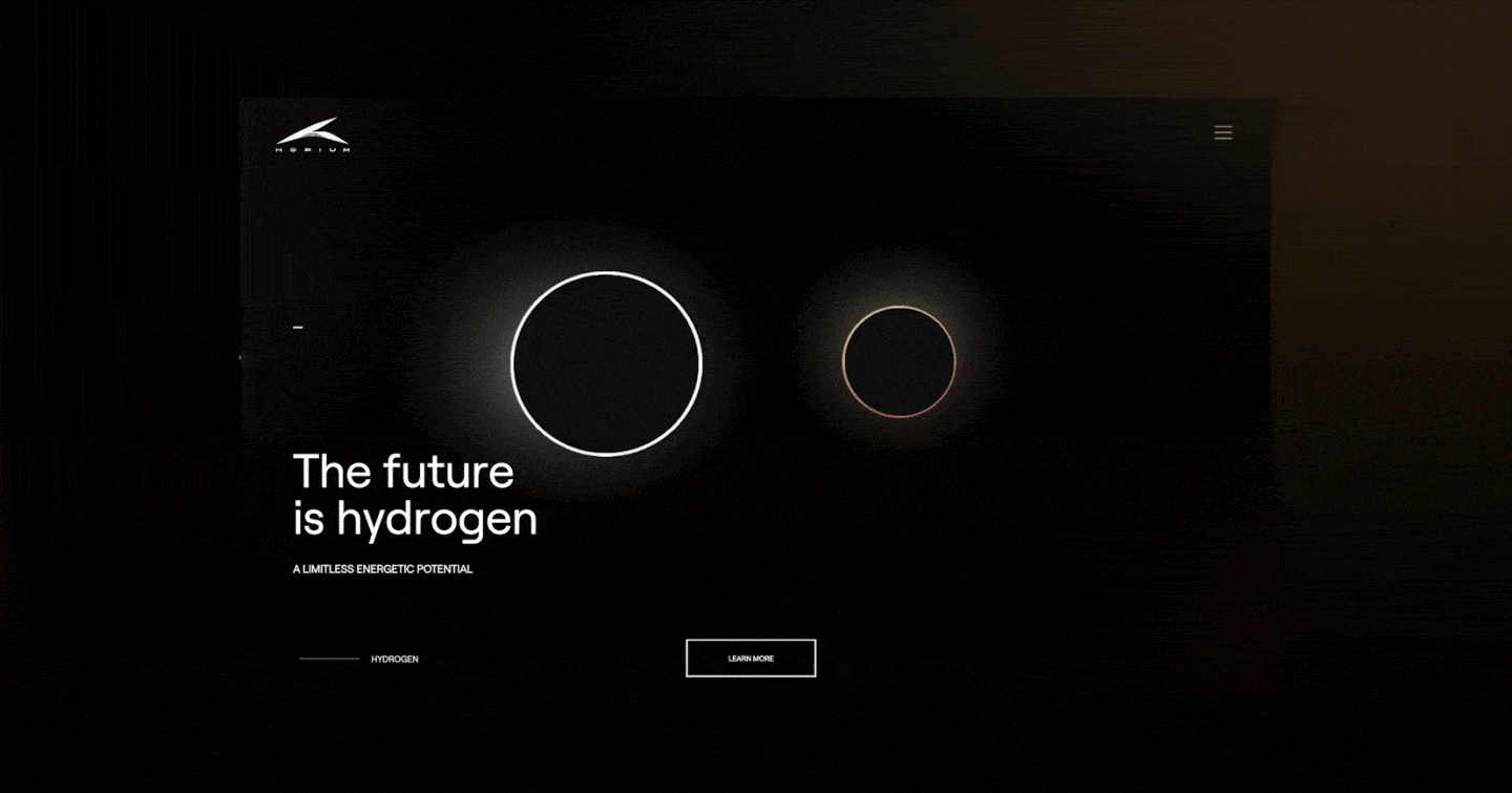 Page web avec le slogan "L'avenir est hydrogène" et un graphique de deux cercles lumineux, un plus grand que l'autre, sur un fond noir
