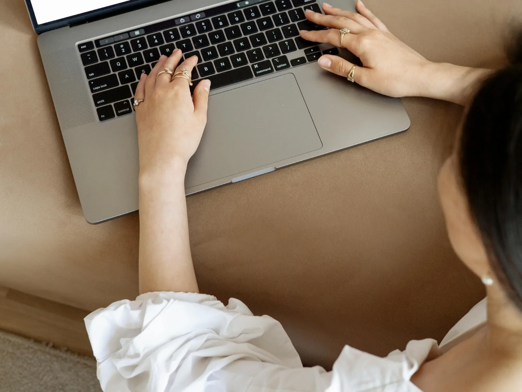 Woman typing on her laptop