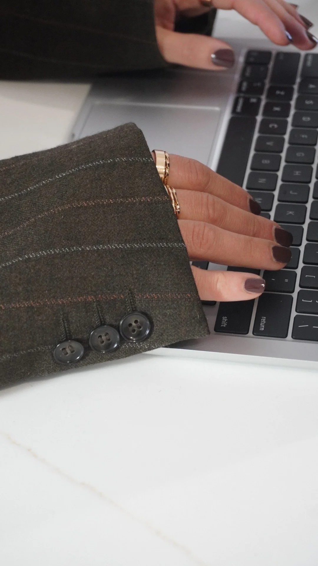 Woman typing on her laptop
