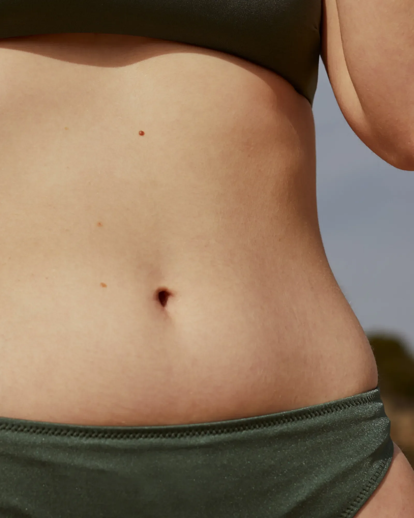 Close-up of a woman's bare stomach