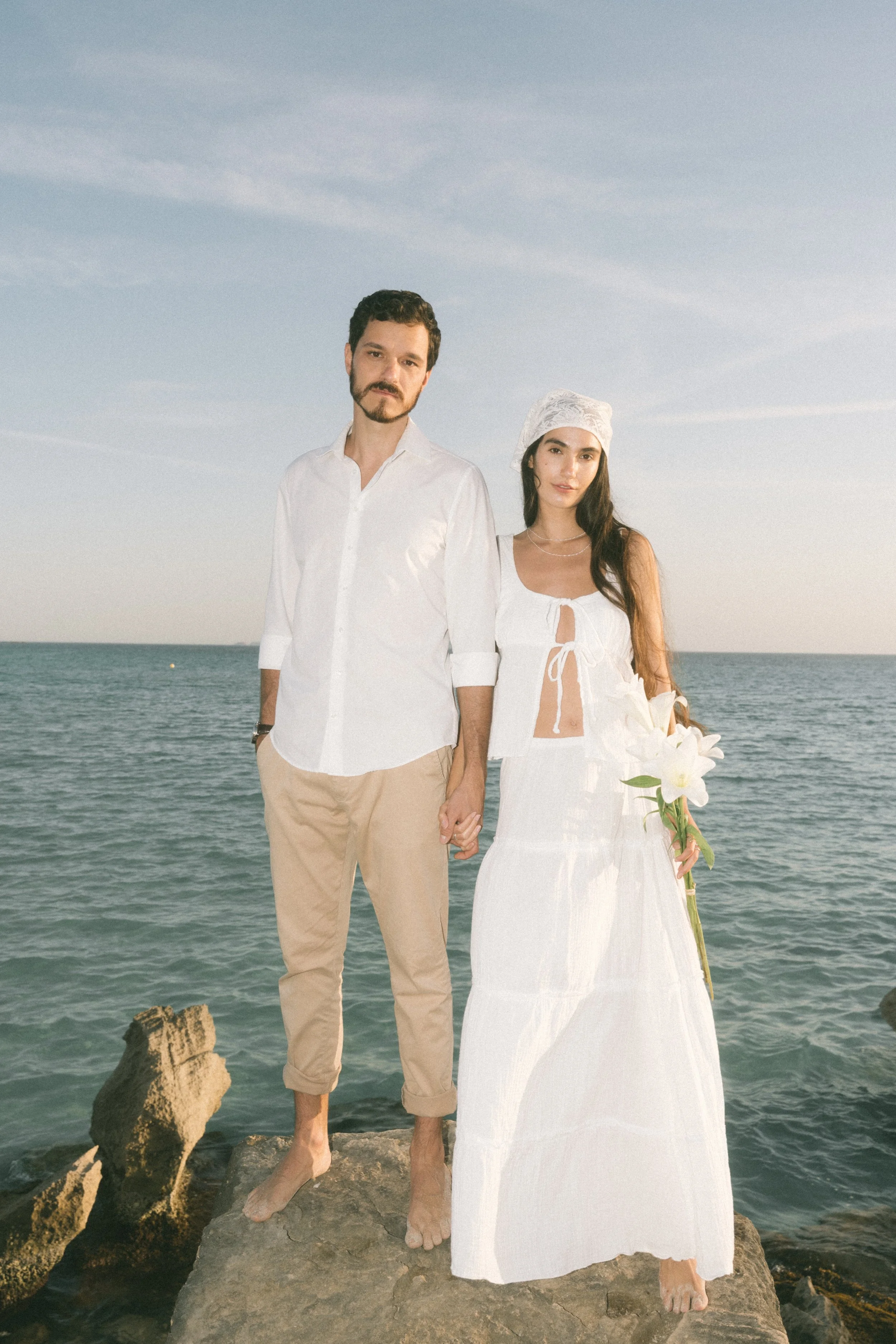Editorial destination wedding photography of a bride and groom by the sea in Europe - Mallorca Wedding