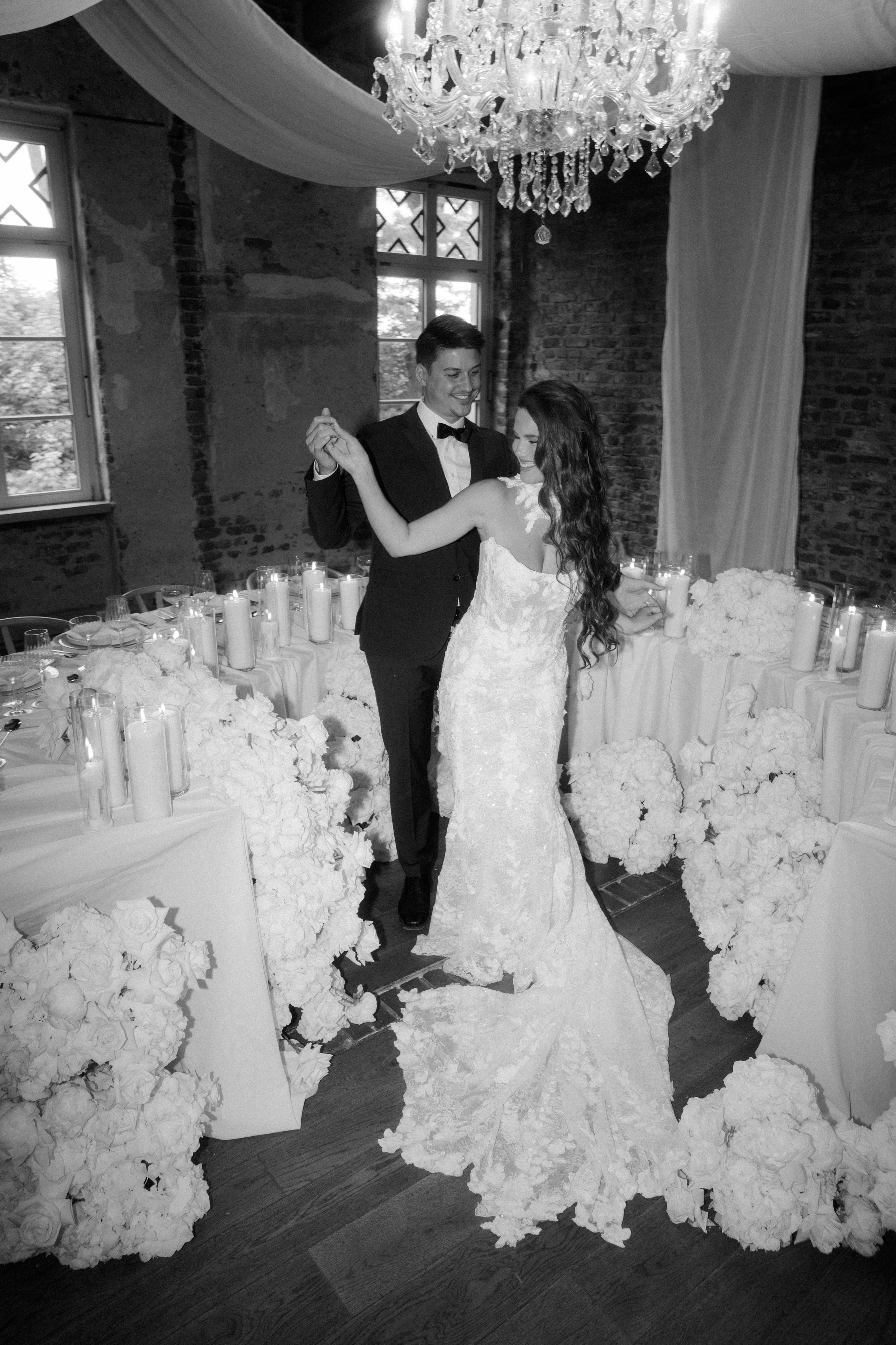 Bride and groom sharing their first dance at a luxury wedding reception photographed by Europe wedding photographer Änna Photography.