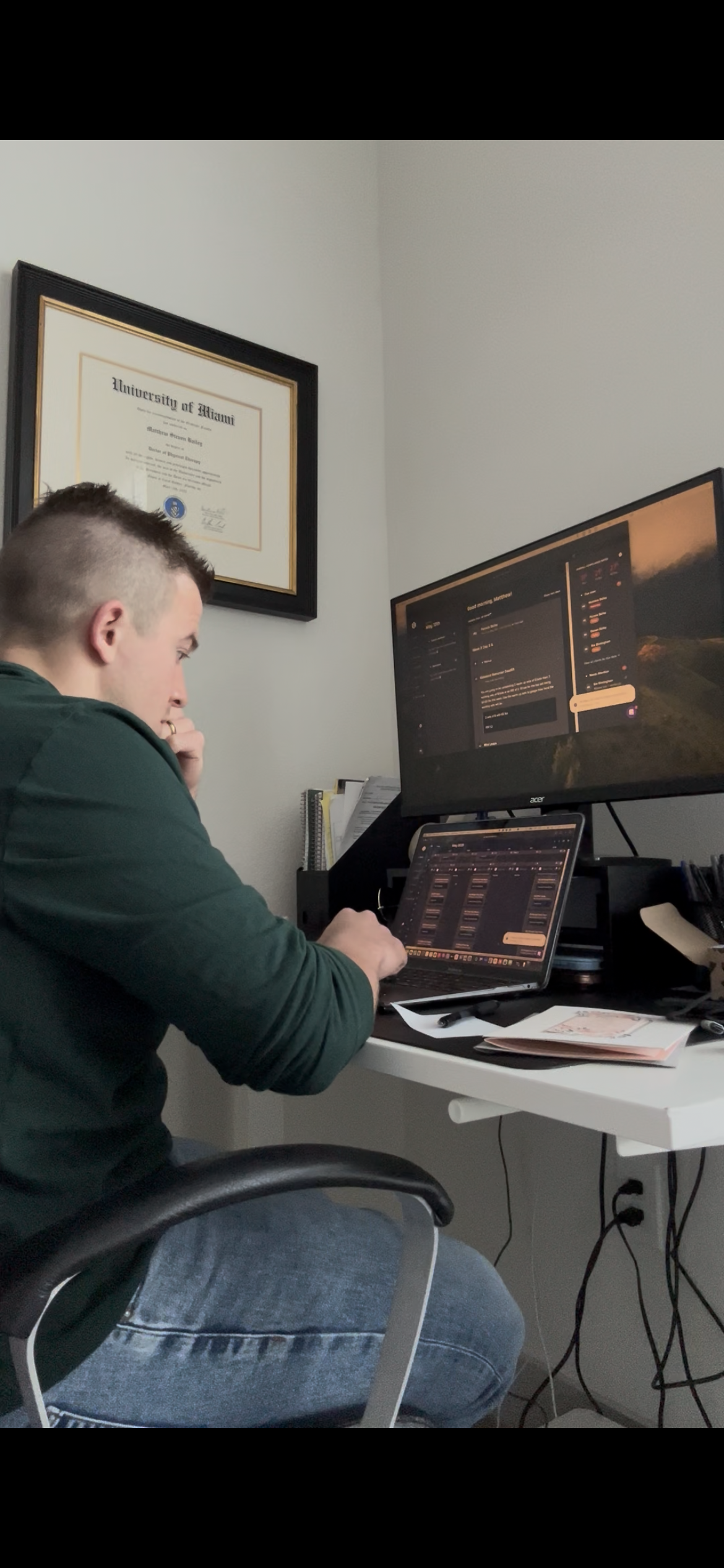 Matt Bailey, DPT, reviewing client video and programming workouts during a remote coaching session at A.I.R. Performance
