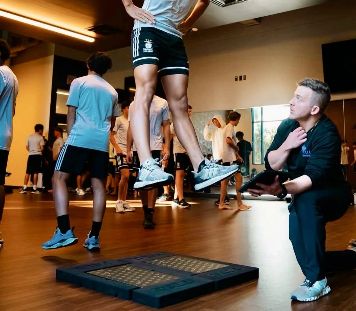 Group force plate testing session measuring strength and power for active adults at A.I.R. Performance