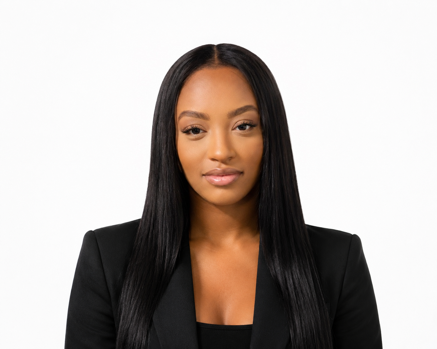 Portrait of a woman with long straight black hair wearing a black blazer against a white background.