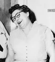 A photograph of Nannie Doss the Giggling Granny being apprehended by police