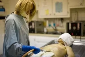 An image of a corpse being embalmed by a mortician
