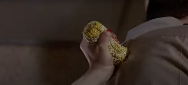 A close-up shot of someone being stabbed with a corncob in the movie Sleepwalkers (1992)