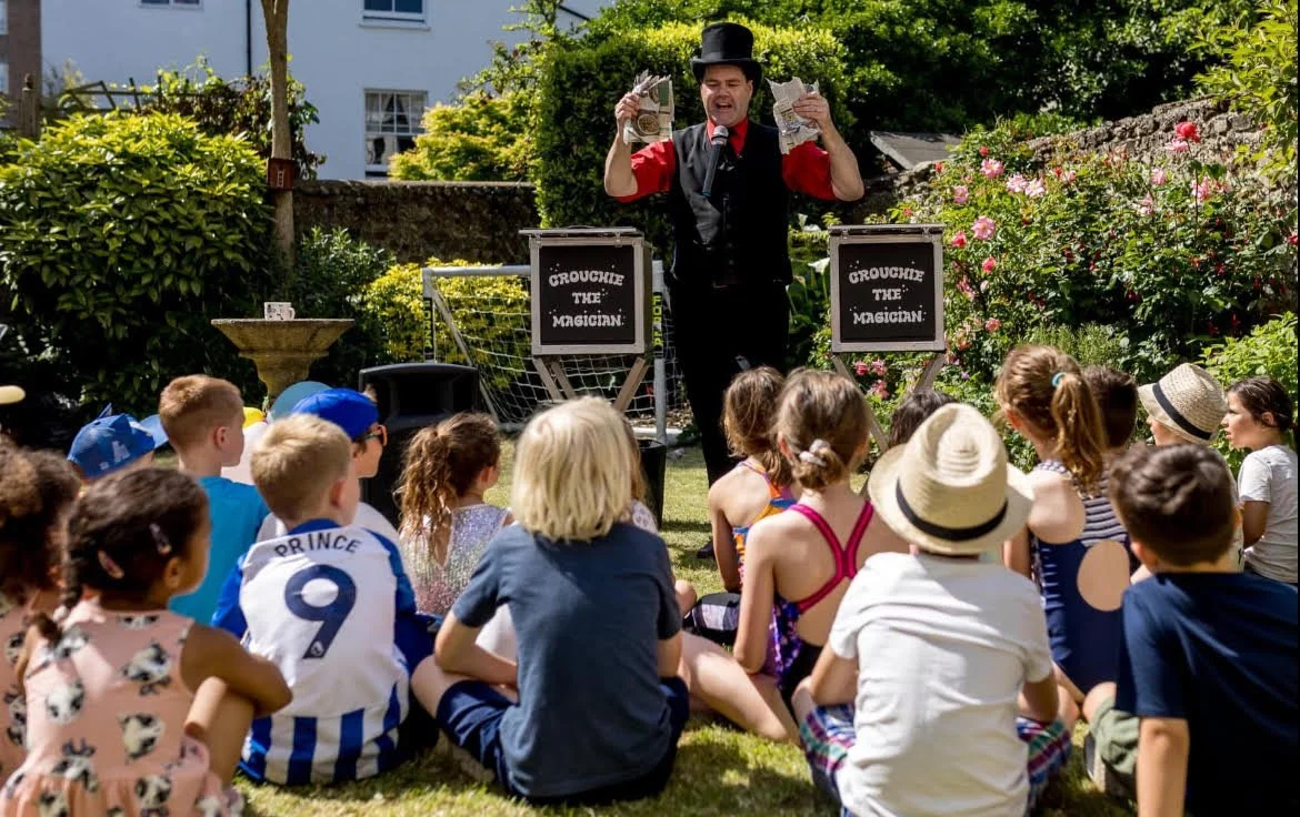 David Croucher magician performs a magic show in a garden