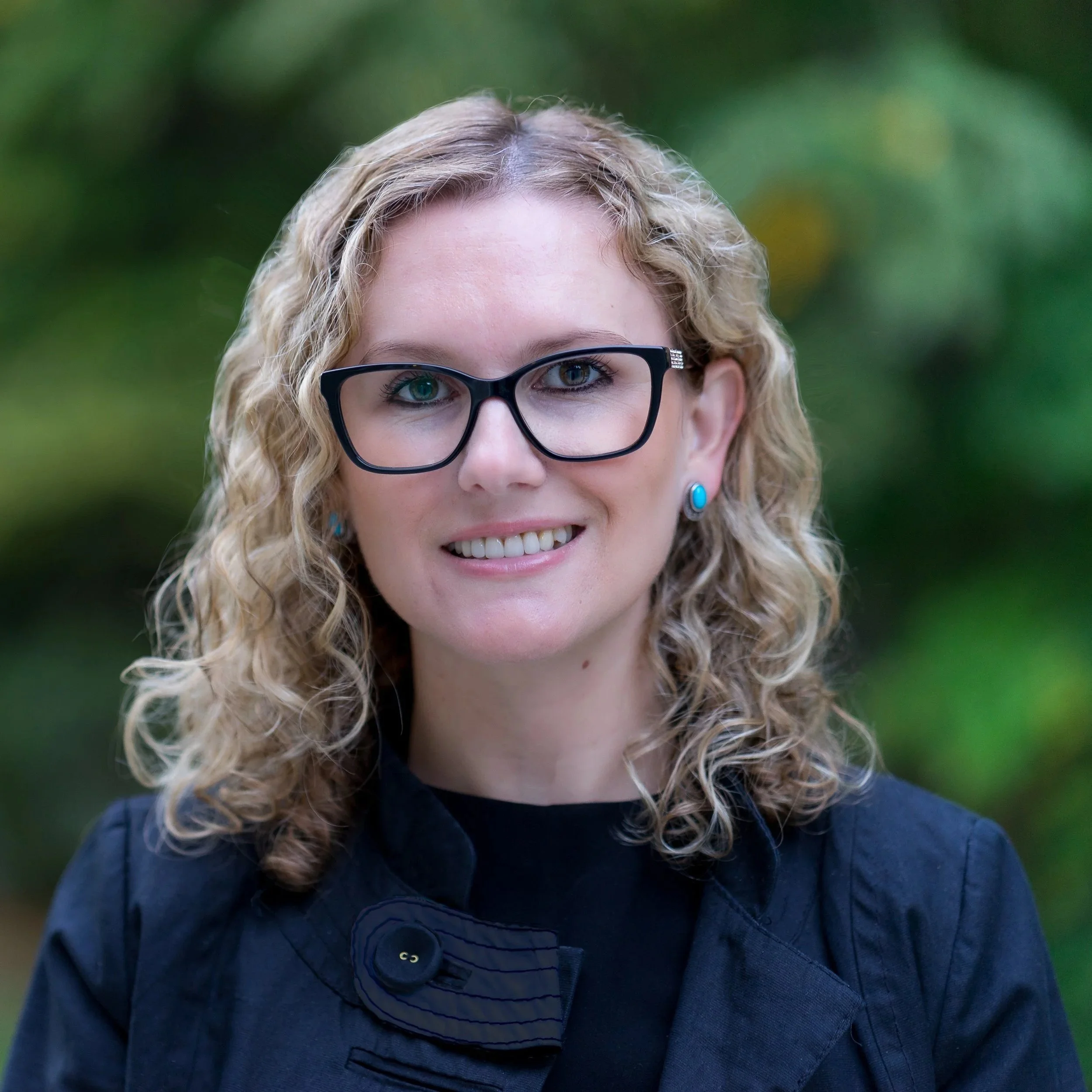 Professional headshot outdoor of woman client review