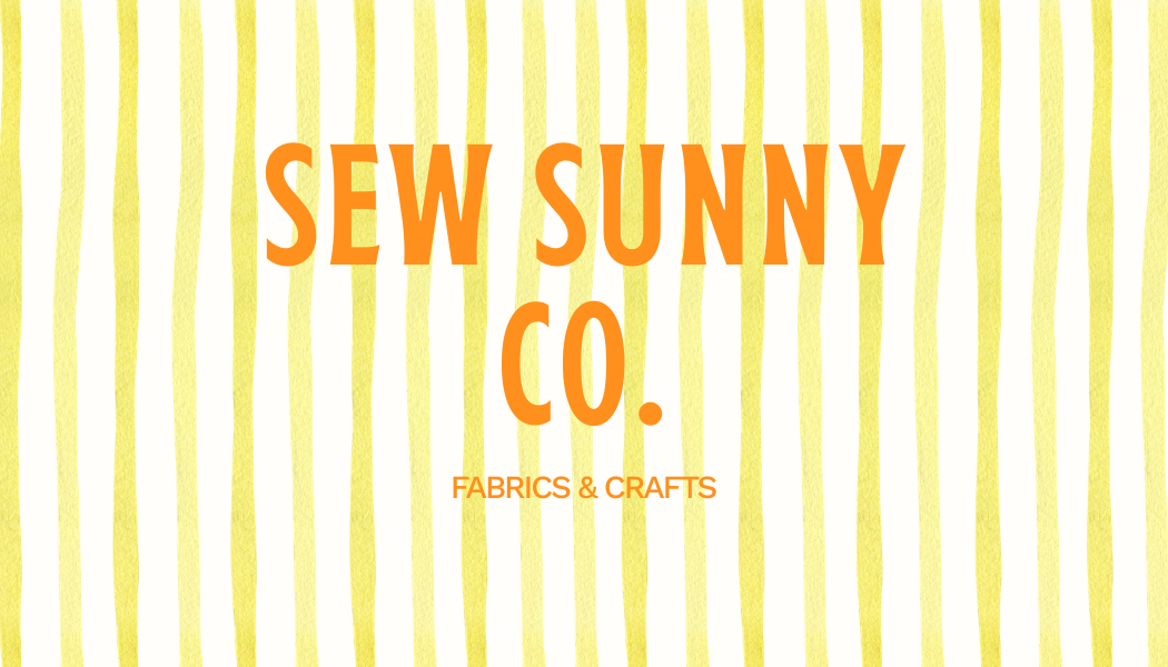 Text in bright orange says "SEW SUNNY CO." with smaller text below that reads "FABRICS & CRAFTS" on a yellow striped background.