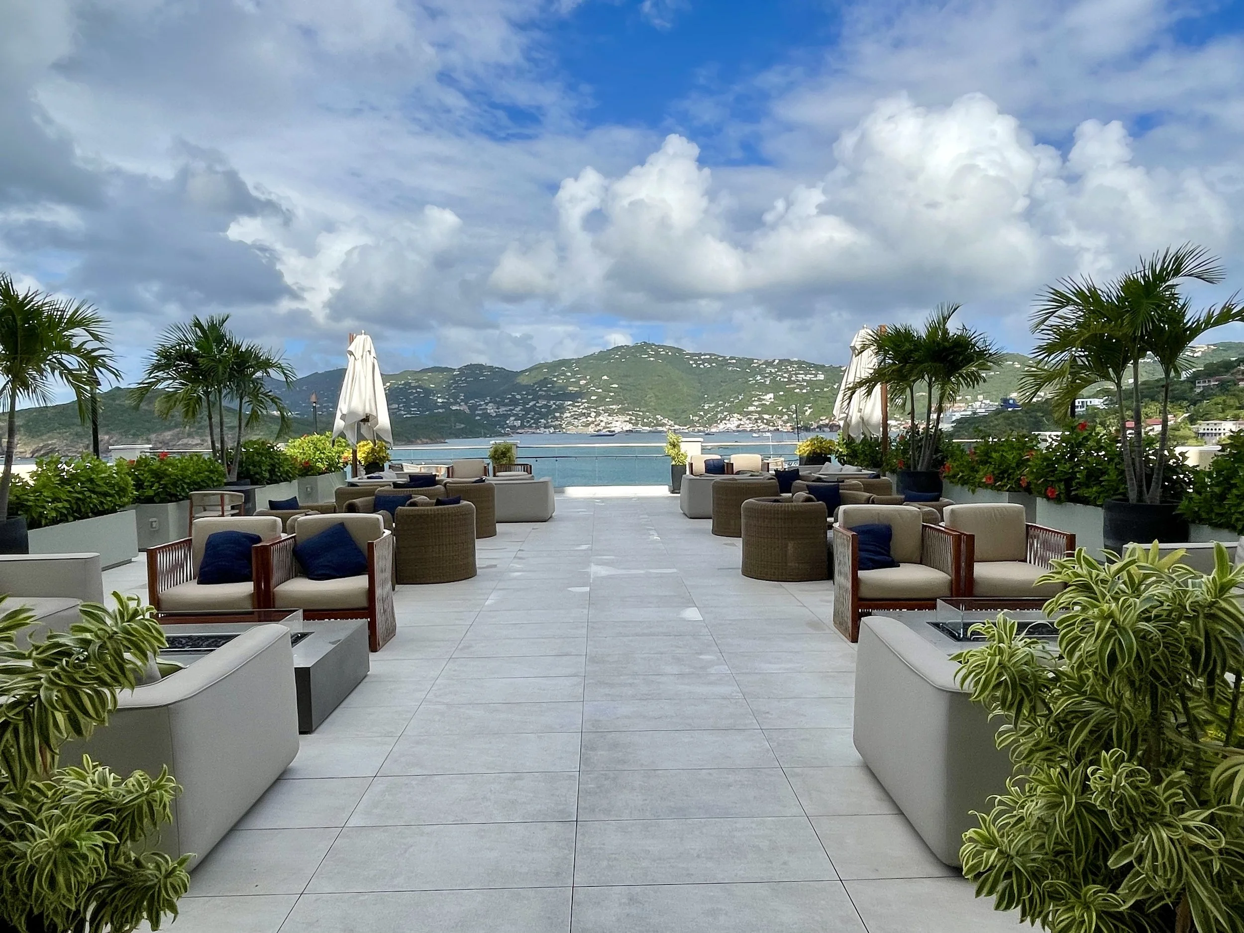 Outdoor terrace with lounge seating overlooking the ocean