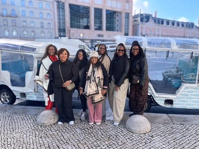 Group of travelers posing together in a city setting