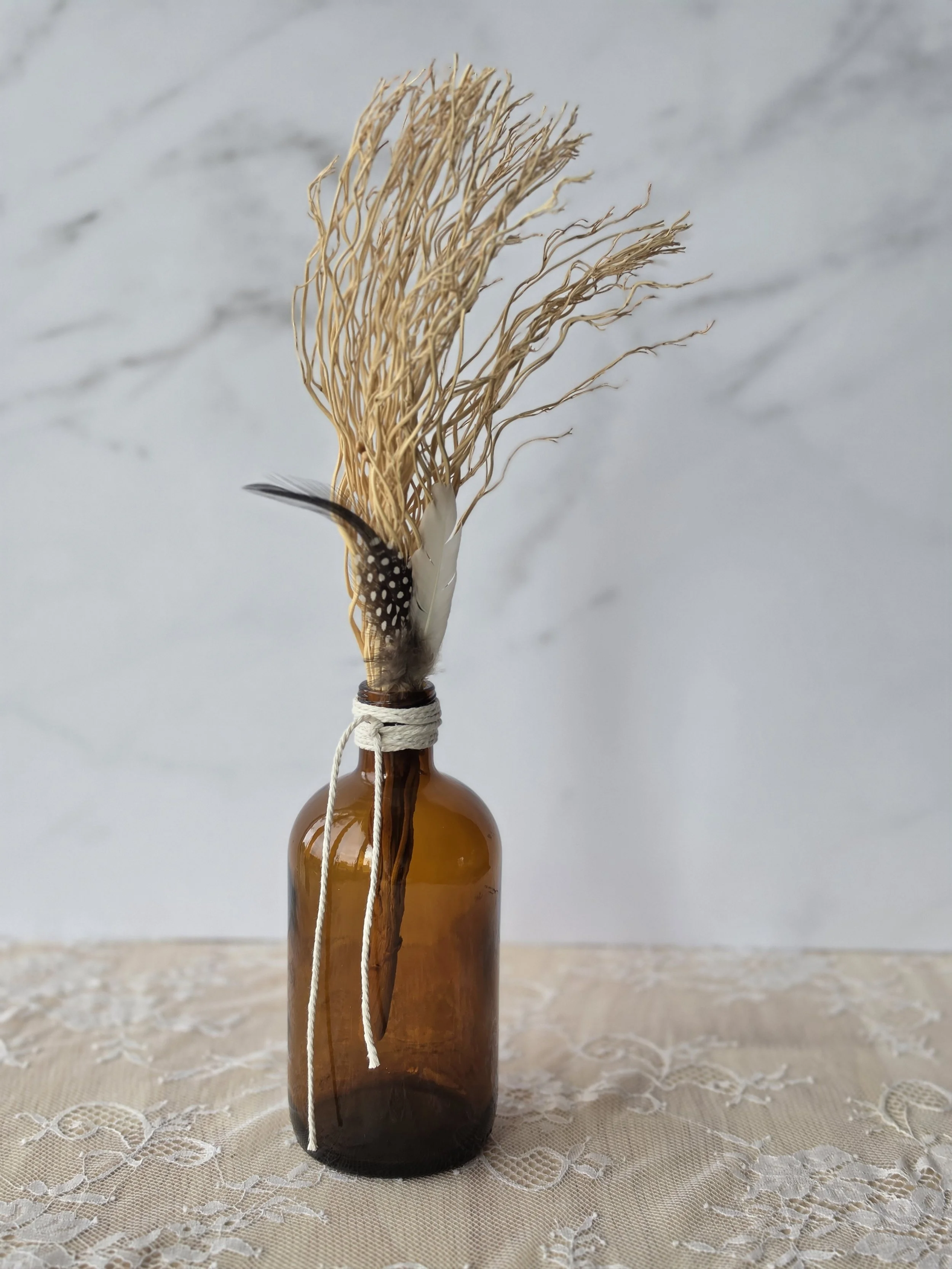 brown vase with feathers.jpg
