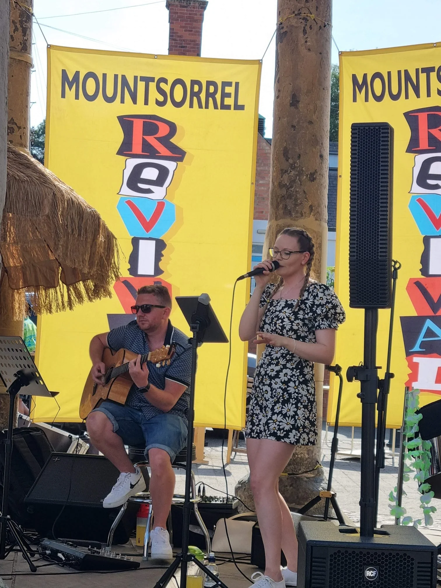 Kay Acoustic performing live with guitar under a bandstand at the Mountsorrel Revival annual festival, providing acoustic live music entertainment in a family-friendly environment.