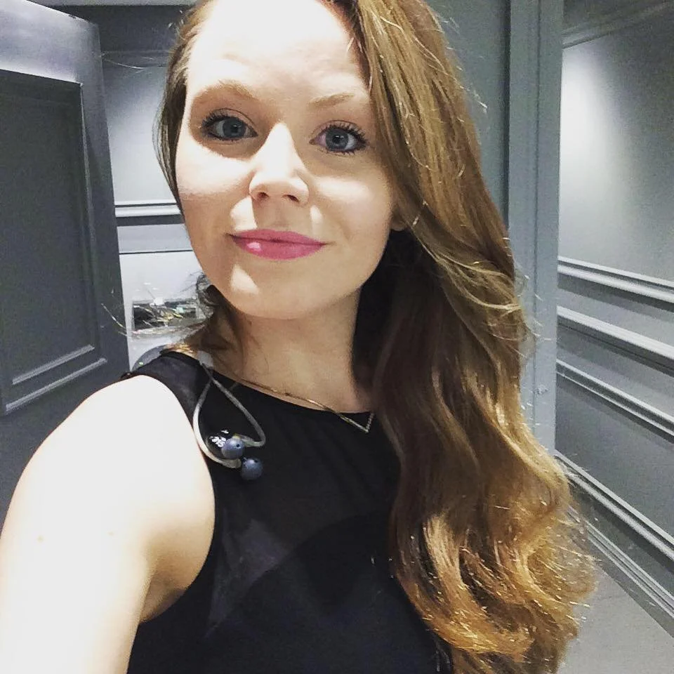 Kay Acoustic behind-the-scenes selfie wearing in-ear monitors, about to go on stage for a live acoustic wedding and event performance.