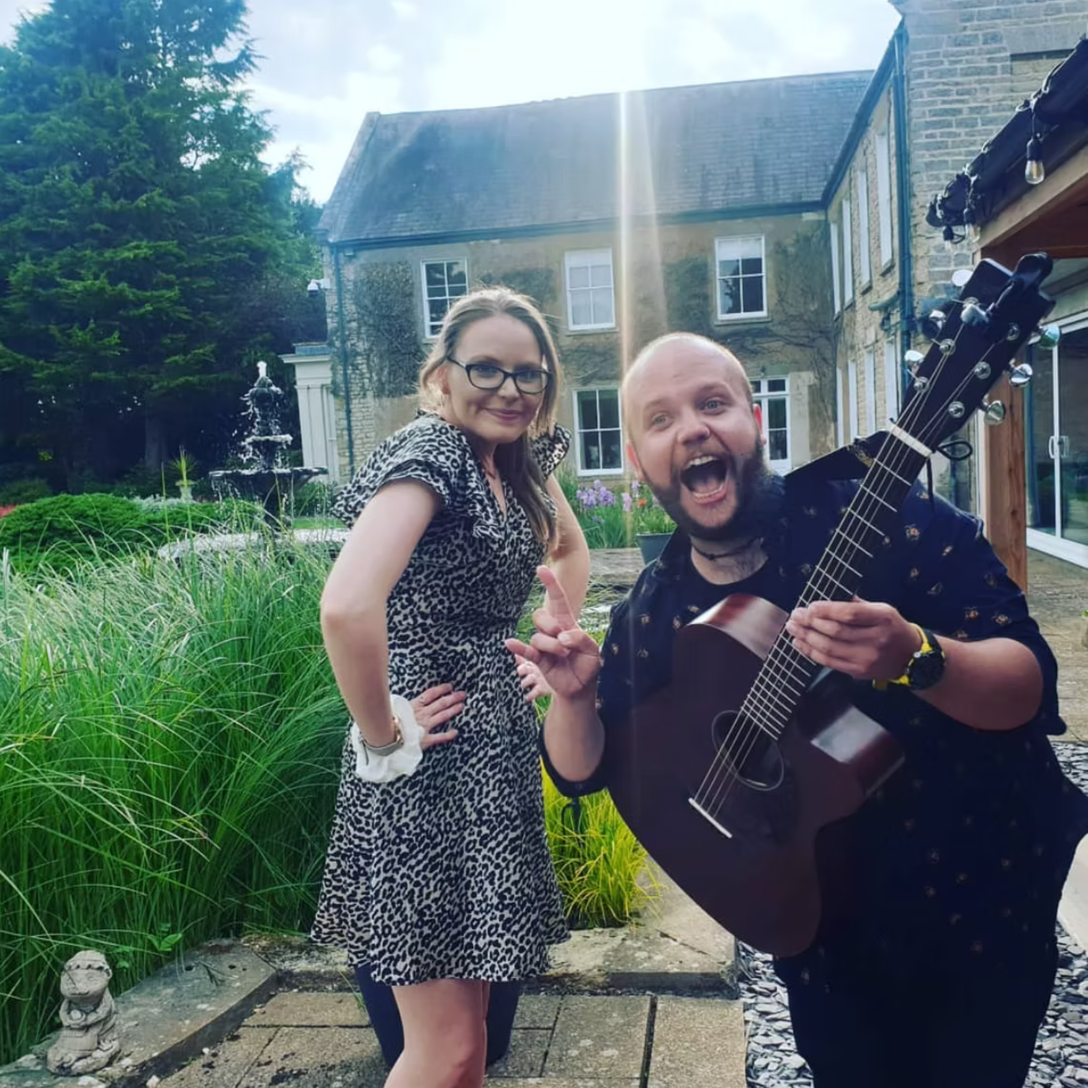 Kay Acoustic live acoustic duo performing outdoors for a wedding drinks reception, providing professional wedding entertainment across the UK.